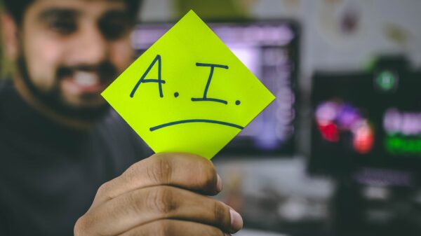 Person holding paper about risks and challenges, particularly for senior citizens about AI.